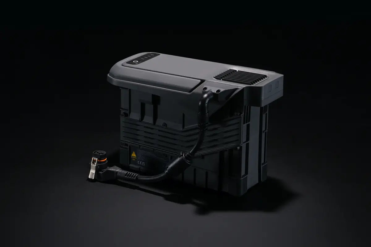 EE GROUP TB100C tethered battery for Matrice 400 drone, showing the compact, rectangular power source with connectors visible.