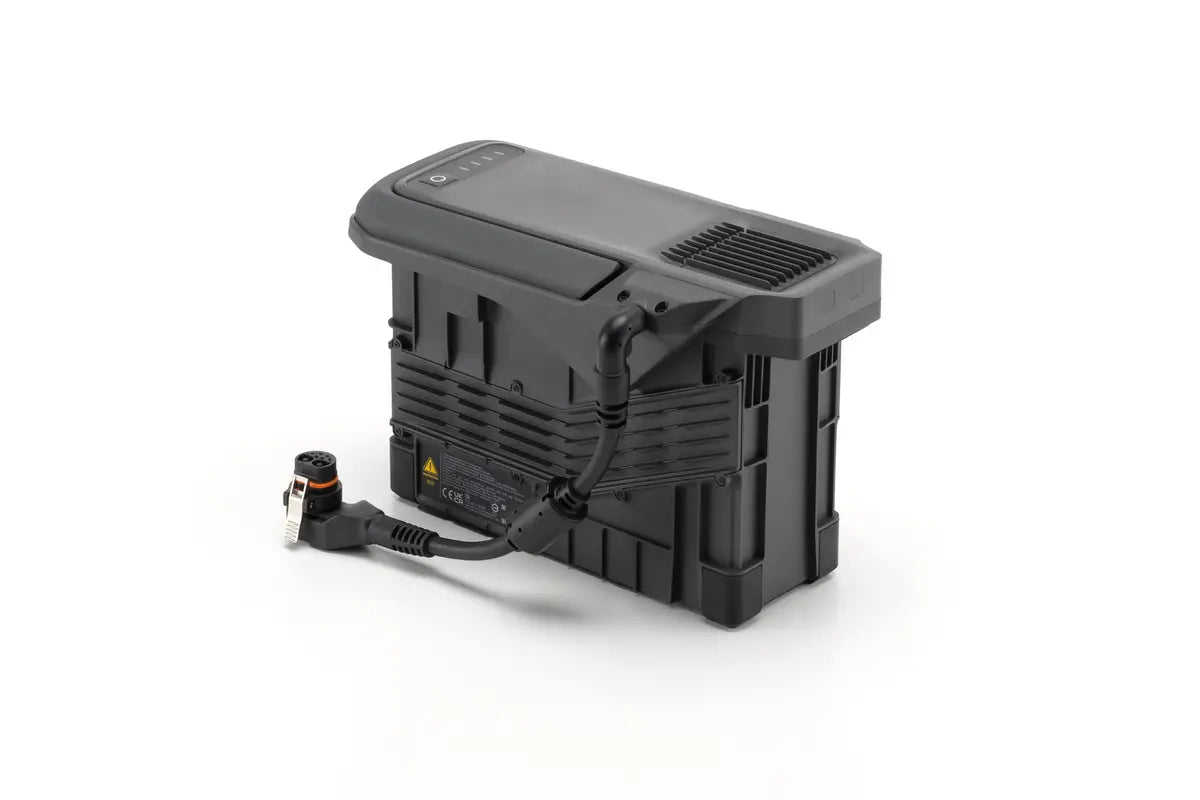 EE GROUP TB100C tethered battery for Matrice 400 drone, showing the compact battery with connector terminals.