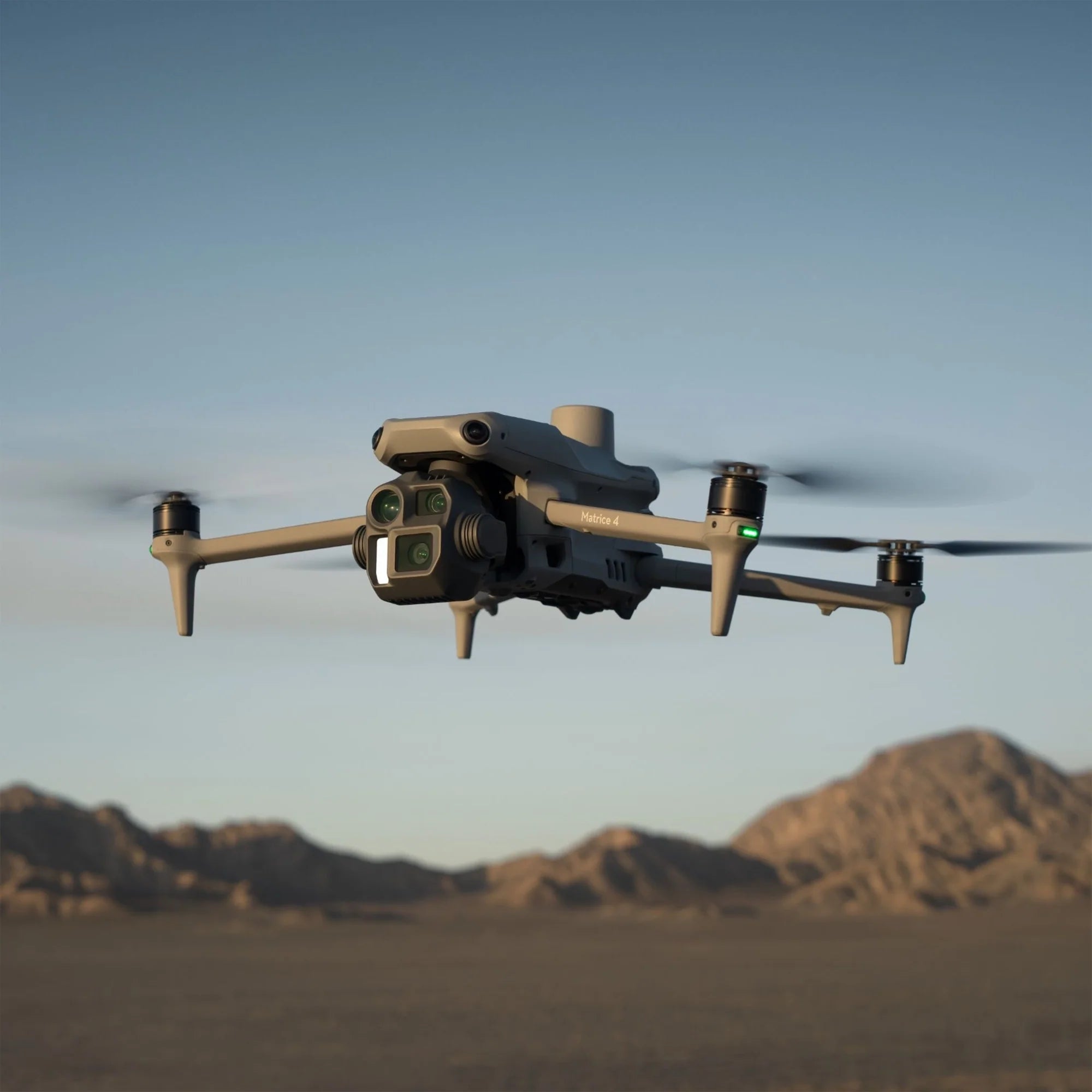 DJI Matrice 4E drone with camera and accessories, displayed on a neutral background, showcasing its compact design and features.